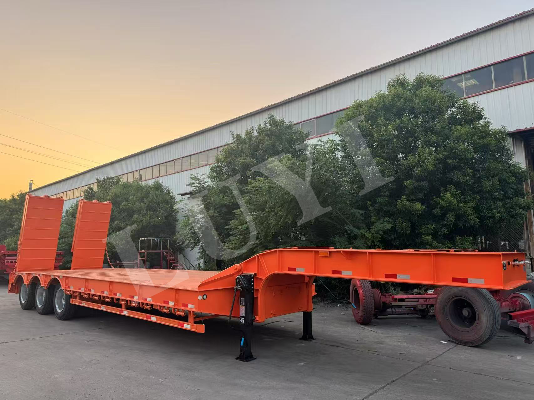 Three three-axle low flatbed semi-trailers shipped to ghana