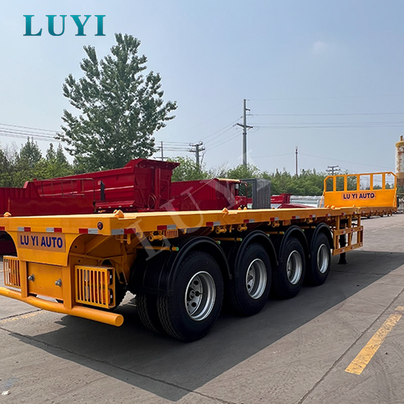 4-axle yellow flatbed semi-tra