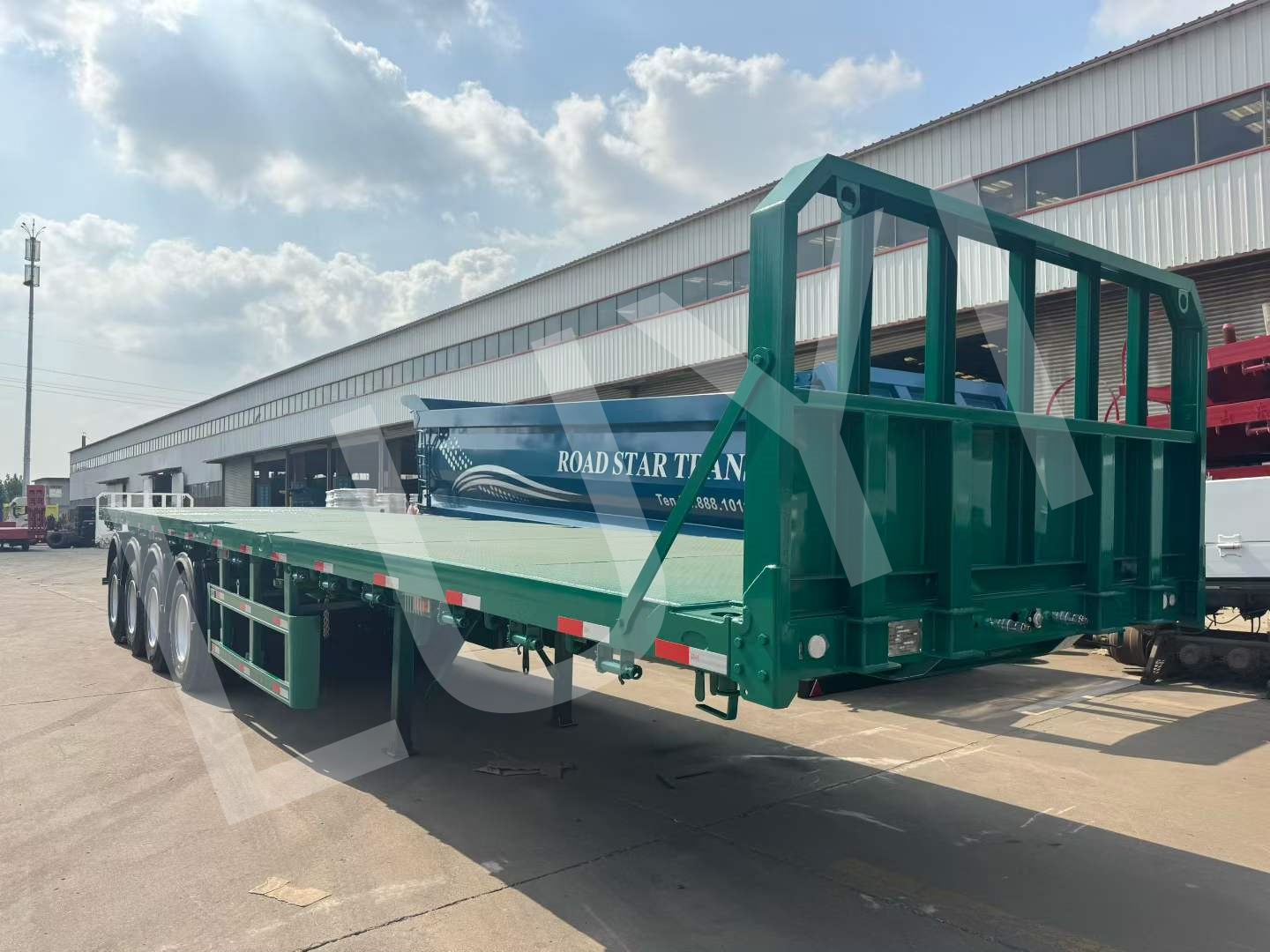 Customized flatbed semi-trailers are being packed in batches and sent to Tanzania
